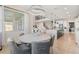 Elegant dining room with a stylish chandelier, comfortable seating, and views into the modern living spaces at 2613 Mead Ave, St Cloud, FL 34771