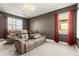 Home theater boasts tiered seating, projector, and dark walls for an immersive experience at 2613 Mead Ave, St Cloud, FL 34771