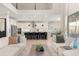 Spacious living room with modern furnishings open to a gourmet kitchen, perfect for entertaining and comfortable living at 2613 Mead Ave, St Cloud, FL 34771