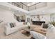 Open-concept living room seamlessly flows into a well-appointed kitchen, ideal for modern living and entertaining guests at 2613 Mead Ave, St Cloud, FL 34771