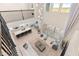Open floor plan showcasing the living room, kitchen, and dining area with high ceilings and large windows at 2613 Mead Ave, St Cloud, FL 34771