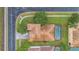 Bird's eye view of a home featuring a tile roof, a pool, and well-maintained landscaping at 2621 Archfeld Blvd, Kissimmee, FL 34747
