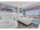 Charming bedroom with two twin beds, Disney themed decor, and a bright, sunny window view at 2621 Archfeld Blvd, Kissimmee, FL 34747