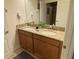 Granite double vanity bathroom with bath mat, shower and interior access at 2943 Banana Palm Dr, Kissimmee, FL 34747