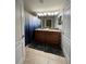 Bathroom featuring a double vanity, shower and granite countertops at 2943 Banana Palm Dr, Kissimmee, FL 34747