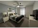Comfortable bedroom with a ceiling fan, carpet, cool, calm wall color and natural light at 2943 Banana Palm Dr, Kissimmee, FL 34747