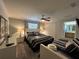 Bedroom with a ceiling fan, carpet, twin bed and access to the bathroom at 2943 Banana Palm Dr, Kissimmee, FL 34747