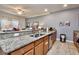 Kitchen with granite countertops, stainless steel appliances, breakfast bar, and ample cabinet space at 2943 Banana Palm Dr, Kissimmee, FL 34747
