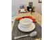 Dining bar fully set for dinner and placed next to coffee bar at 2943 Banana Palm Dr, Kissimmee, FL 34747
