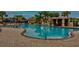 Large community pool with unique rock features and a slide for hours of fun at 2943 Banana Palm Dr, Kissimmee, FL 34747