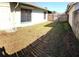 A view of the home's rear yard featuring a wood fence at 3188 Owassa Ct, Kissimmee, FL 34746
