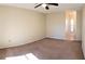 Spacious carpeted bedroom with a ceiling fan at 3188 Owassa Ct, Kissimmee, FL 34746