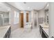 Luxury bathroom showcasing dual vanities, a freestanding tub, and a glass shower at 3205 Heirloom Rose Pl, Oviedo, FL 32766