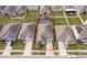 Aerial view of property with a pool, surrounded by neighboring homes and landscaping, defined by red line at 4418 Blackbird St, Kissimmee, FL 34746