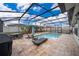 Relax by the sparkling screened-in pool and enjoy the Florida sunshine in your private backyard oasis at 4418 Blackbird St, Kissimmee, FL 34746