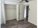 Bedroom featuring luxury vinyl plank flooring and a closet at 4903 Lake Ridge Rd # Ge, Orlando, FL 32808