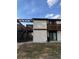 Angled view of a two-story building with balconies, stucco walls, and dark trim, offering outdoor living at 4903 Lake Ridge Rd # Ge, Orlando, FL 32808