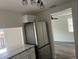 Contemporary kitchen equipped with stainless steel appliances, granite countertops, and sleek, white cabinetry at 4903 Lake Ridge Rd # Ge, Orlando, FL 32808