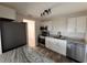 Bright kitchen featuring new countertops, stainless steel appliances, modern fixtures, and stylish flooring at 4903 Lake Ridge Rd # Ge, Orlando, FL 32808