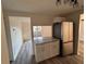 Well-appointed kitchen with granite counters, new cabinets, stainless appliances, and a view into the living area at 4903 Lake Ridge Rd # Ge, Orlando, FL 32808