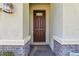 A welcoming front door with decorative glass and stone accents at 4976 Creekside Park Ave, Orlando, FL 32811