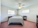 Bedroom with two windows, ceiling fan, and simple decor at 515 Spring Oaks Blvd, Altamonte Springs, FL 32714