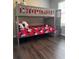 This bedroom features hardwood floors and a gray bunk bed with red Mickey Mouse bedding at 569 La Mirage St, Davenport, FL 33897