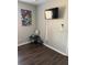 Bedroom featuring luxury vinyl flooring and wall-mounted television with comic book artwork on the wall at 569 La Mirage St, Davenport, FL 33897
