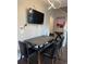 Modern dining area with stylish table, chairs, and chandelier lighting at 569 La Mirage St, Davenport, FL 33897