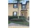 Condo exterior with landscaping, sidewalk, and front door at 569 La Mirage St, Davenport, FL 33897