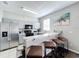 Modern kitchen featuring gray cabinetry, stainless steel appliances, and breakfast bar at 569 La Mirage St, Davenport, FL 33897