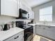 Well-equipped kitchen featuring modern appliances, sleek countertops, and ample cabinet space at 569 La Mirage St, Davenport, FL 33897