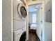 Stackable washer and dryer next to a bedroom at 569 La Mirage St, Davenport, FL 33897