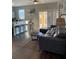 Open living space showcasing kitchen bar with view to living room area at 569 La Mirage St, Davenport, FL 33897