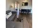 Inviting living room area with view into dining area and lots of natural light at 569 La Mirage St, Davenport, FL 33897