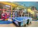 Indoor play area with air hockey and games at 569 La Mirage St, Davenport, FL 33897