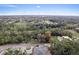 Wide aerial shot showcasing a beautiful wooded lot surrounded by lush trees at 572 Sanctuary Golf Pl, Apopka, FL 32712