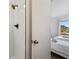 Modern bathroom features a tiled walk-in shower and a view of the adjacent bedroom at 6165 Carrier Dr # 2306, Orlando, FL 32819