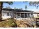 The home features a screened in porch, wood deck, and a fenced in yard at 6356 Sleepy Hollow Dr, Orlando, FL 32810