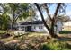 Backyard view showcasing the patio, wood deck, and fenced in yard at 6356 Sleepy Hollow Dr, Orlando, FL 32810