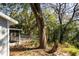 Backyard view of the screened in porch and a wood deck at 6356 Sleepy Hollow Dr, Orlando, FL 32810