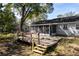 A well-maintained backyard deck overlooks the property's outdoor space at 6356 Sleepy Hollow Dr, Orlando, FL 32810