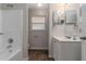 Bathroom features a tub shower, toilet, and vanity with mirror at 6356 Sleepy Hollow Dr, Orlando, FL 32810
