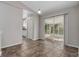 Open dining space featuring tile floors, sliding glass doors, and easy access to the kitchen at 6356 Sleepy Hollow Dr, Orlando, FL 32810