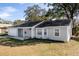 Charming single-story home with well-maintained lawn and attached one-car garage at 6356 Sleepy Hollow Dr, Orlando, FL 32810