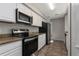Efficient kitchen featuring modern stainless steel appliances and granite countertops at 6356 Sleepy Hollow Dr, Orlando, FL 32810