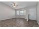 Inviting living room with natural light from bay window and stylish tile flooring at 6356 Sleepy Hollow Dr, Orlando, FL 32810