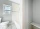 Updated bathroom with a window, white subway tiles, and sleek fixtures at 6408 Ridge Ter, Orlando, FL 32810