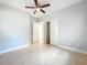 Bedroom with closet, tile flooring, and a ceiling fan at 6408 Ridge Ter, Orlando, FL 32810