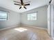 Bedroom featuring a ceiling fan, tile floors, and two windows at 6408 Ridge Ter, Orlando, FL 32810